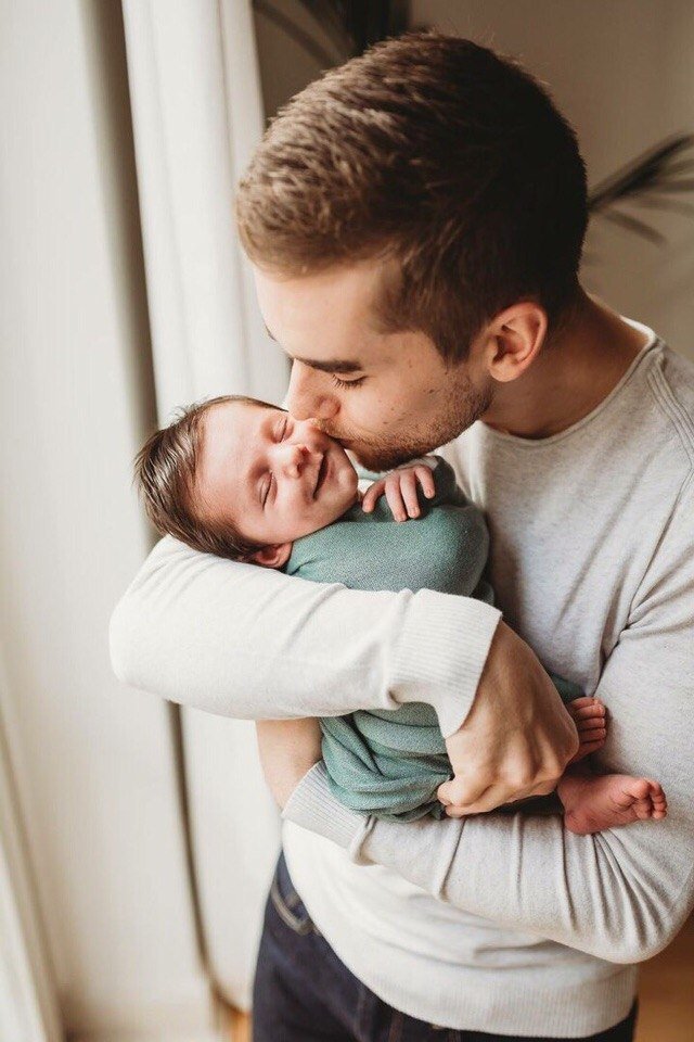 Dad feeding baby